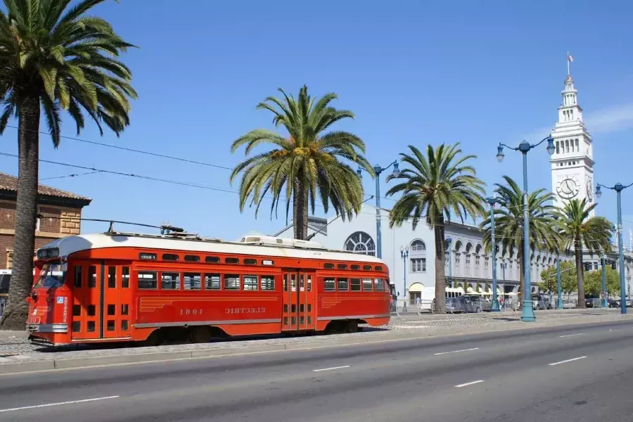 Line streetcar rolls down The Embarcadero in front of The Ferry Building.